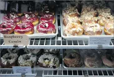  ??  ?? SuzyQ Doughnuts in Hintonburg, west of Ottawa’s downtown, is one of the cult takeout joints that has sprouted up alongside such area anchors as a Giant Tiger discount store. Flavours include lemon raspberry and toasted coconut.