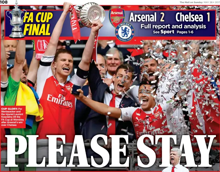  ??  ?? CUP GLORY: Per Mertesacke­r and the injured Laurent Koscielny lift the FA Cup at Wembley after Arsenal’s win over Chelsea