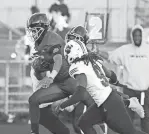  ?? KIRTHMON F. DOZIER/DFP ?? QB Dante Moore (5) passed for three touchdowns on Friday against River Rouge and added 50 yards on the ground in Detroit King’s 41-28 victory.