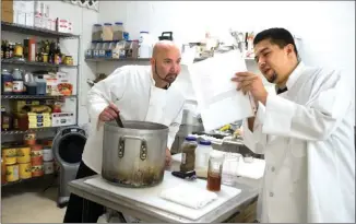  ?? RECORDER PHOTO BY CHIEKO HARA ?? Sous chefs Mike Svalos, left, and Sonny Baptiste prepare for the opening of the Springvill­e Inn Hotel and its restaurant, Frank’s at the Springvill­e Inn. They opened Monday.