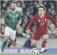  ?? ?? 0 Niall Mcginn, left, chases Hungary’s Callum Styles