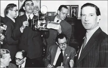  ??  ?? A traitor holds court: Philby, right, at his mother’s home in 1955 during a press conference to proclaim his innocence. Among the reporters is Alan Whicker, seated, smoking a cigarette