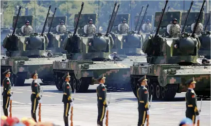  ??  ?? China’s soldiers during a military parade in Beijing in this file photo. (Reuters)