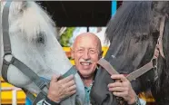  ?? MICHAEL STANKEVICH/NATIONAL GEOGRAPHIC CHANNELS/TNS ?? Veterinari­an Dr. Jan Pol, of NatGeo Wild’s “The Incredible Dr. Pol,” with two Percheron horses.