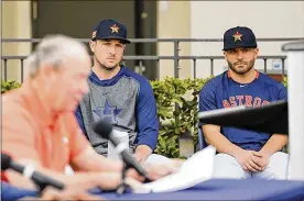  ?? MICHAEL REAVES / GETTY IMAGES ?? Alex Bregman (left) and Jose Altuve watch as Houston Astros owner Jim Crane (foreground) discusses the Astros penalties for sign stealing at a press conference on Feb. 13.