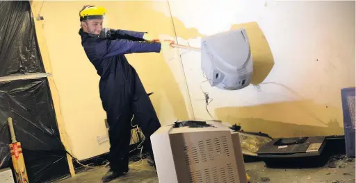  ?? Pictures: Adrian White ?? Declan Stewart, kitted out in protective clothing, lets off steam at Destructio­n Time.