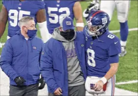  ?? Mike Stobe / Getty Images ?? Giants coach Joe Judge, center, and QB Daniel Jones, right, celebrated a win on Sunday, the team’s sixth of the season, a step forward.