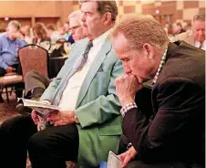  ?? [OKLAHOMAN ?? Participan­ts bow their heads in prayer during the 2017 CBMC Metro OKC Prayer Breakfast at the Cox Convention Center in Oklahoma City.