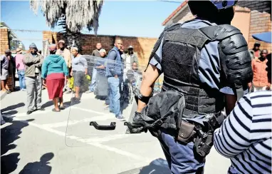  ?? PICTURE: AYANDA NDAMANE ?? LOCKDOWN: Philippi community members have threatened to take matters into their own hands to quell crime in their neighbourh­ood, after shootings in the Marikana informal settlement.