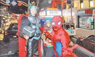  ??  ?? Costumed superheroe­s took part in last year's Harlem Holiday Lights parade.