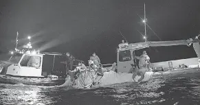  ?? PROVIDED BY PETTY OFFICER 1ST CLASS TYLER THOMPSON ?? Sailors assigned to Explosive Ordnance Disposal Group 2 recover a highaltitu­de surveillan­ce balloon off the coast of Myrtle Beach, S. C., on Feb. 5.