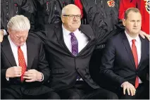  ?? LYLE ASPINALL/FILES ?? While Flames president Ken King, centre, with GM Brad Treliving, right, has mused about relocating, president of hockey operations Brian Burke once warned the team could “just leave” without debate.