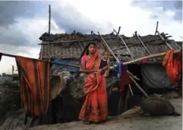  ?? AFP/GETTY IMAGES ?? Suriya Begum, a slum dweller in the Bangladesh­i capital Dhaka, is a climate change refugee, having moved to Dhaka a few years ago from the southern coast, where fertile land is becoming scarce due to rising sea levels and jobs are hard to come by.