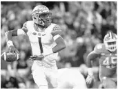  ?? RAINIER EHRHARDT/AP ?? FSU quarterbac­k James Blackman’s intercepti­on hindered the Seminoles’ late rally against Clemson.