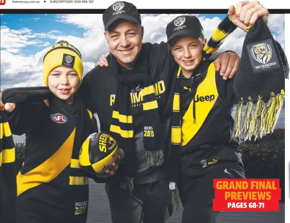  ??  ?? Richmond fans Richard Atkins, of Sandy Bay, and sons Archer, 10, and Lachie, 13, are heading to Brisbane for the grand final. Picture: Zak Simmonds