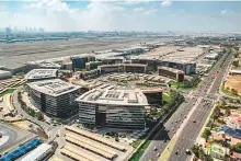  ?? ?? The DIEZ economic zones include the Dubai Airport Free Zone (above), Dubai Silicon Oasis, and Dubai CommerCity, in addition to its subsidiari­es.