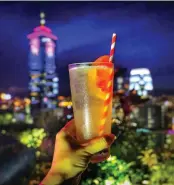  ??  ?? Clockwise from top: The popular terrace at Cé La Vi Hong Kong; a sturdy paper straw in a cocktail; the lush Zuma interiors; bartender Arkadiusz Rybak