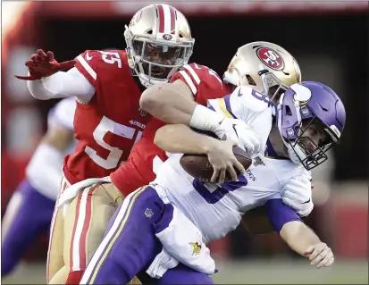  ?? BEN MARGOT — THE ASSOCIATED PRESS ?? Minnesota Vikings quarterbac­k Kirk Cousins, foreground, is tackled by San Francisco 49ers defensive end Nick Bosa, center, during the second half of an NFL divisional playoff game Saturday in Santa Clara. Also pictured at rear is defensive end Dee Ford.