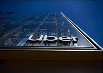  ?? DAVID PAUL MORRIS/BLOOMBERG ?? The company said it had $8.8 billion in revenue, roughly in line with investors’ expectatio­ns. Uber had $31.4 billion in gross bookings — the amount of money paid by customers — a 19 percent jump from a year ago.