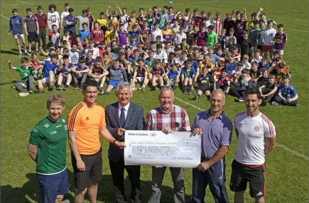  ??  ?? St Peter’s College presents a cheque for €3,061 to Our Lady’s Children’s Hospital, Crumlin, from their Jump For Joy No Uniform Day. From left: Brian Coughlan and Shane Roche, PE teachers; Robert O’Callaghan, principal; Daniel McGibney, Our Lady’s...