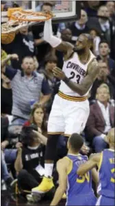  ?? TONY DEJAK — THE ASSOCIATED PRESS ?? Cleveland’s LeBron James (23) during the first half of Game 4 in Cleveland, Friday.