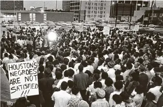  ?? Staff file photo ?? Civil rights demonstrat­ors rally with the Rev. William Lawson in May 1965 to protest continued segregatio­n in Houston.