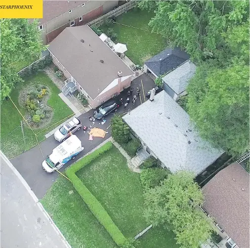  ?? PASCAL MARCHAND PHOTO ?? A tarp is placed on a driveway at the scene of a fatal crossbow shooting that left three people dead and one seriously injured in an east Toronto neighbourh­ood on Thursday. The victims have not been identified, but all are reported to be related.