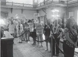  ?? JOSEPH BUSTOS jbustos@thestate.com ?? Demonstrat­ors speaking against the proposed “Help not Harm” bill, which would prevent a minor’s gender transition, wait outside the South Carolina Senate chambers at the State House on Wednesday, May 1, 2024. The bill passed Thursday 27-8