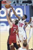  ?? Lynne Sladky / Associated Press ?? Heat guard Goran Dragic (7) shoots as Pistons guard Josh Jackson defends in the second half on Saturday.