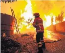  ??  ?? INFERNO Firefighte­r battles flames