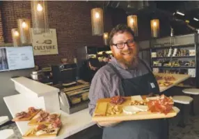  ??  ?? Justin Brunson, pictured inside The Denver Central Market in September, is planning to open Rocky Mountain Charcuteri­e. Helen H. Richardson, Denver Post file