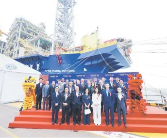  ?? ?? Representa­tives of Yinson, Yinson Production, Petróleo Brasileiro SA and Cosco Shipping Heavy Industry together with FPSO Maria Quitéria in the background after the grand naming ceremony for the vessel in China.