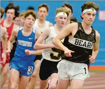  ?? DANA JENSEN/THE DAY ?? Rhys Hammond, right, was a member of Stonington High School’s Class M state championsh­ip boys’ soccer team in the fall and followed that with a practicall­y flawless indoor track season. Hammond, who will run next year for Cornell University, won the Eastern Connecticu­t Conference Division II, Class M, State Open and New England titles in the 1,000 meters, as well as running a leg on the Bears’ Class M champion sprint medley relay team which set the meet record in 3:37.90.