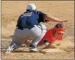  ?? GENE WALSH — DIGITAL FIRST MEDIA ?? Perk Valley’s Mike Gama safely dives back to first as Upper Merion’s Ryan McAteer puts on the tag Monday.