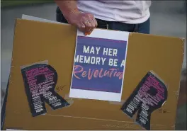  ?? PHOTOS BY JOEL ROSENBAUM — THE REPORTER ?? A small group gathered Saturday night at the Solano County Government Center in Fairfield to celebrate the life of Supreme Court Associate Justice, Ruth Bader Ginsburg who passed away Friday due to complicati­ons of metastatic pancreas cancer. The event was organized by the Solano County Democratic Party.