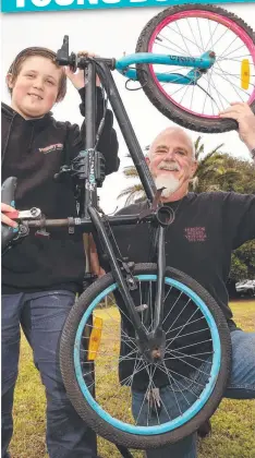  ?? Picture: JOSH WILLIAMSON ?? READY TO ROLL: MacKillop Family Services’ pilot bike program participan­t Bradley Donnelly and program facilitato­r Rick Bromley.