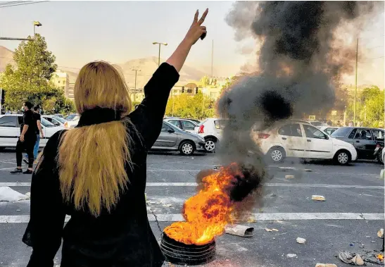  ?? Photo / AP ?? Female demonstrat­ors have burned their mandatory hijab head coverings in Iran.