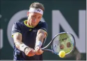  ?? MARTIAL TREZZINI — THE ASSOCIATED PRESS ?? Defending champion Casper Ruud defeated Benoit Paire to survive the second round of the Geneva Open.