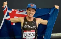  ?? PHOTOSPORT ?? New Zealand’s Zane Robertson after winning the bronze medal in the men’s 5000 metre final at the 2014 Commonweal­th Games.