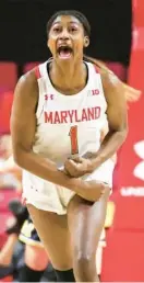  ?? JULIA NIKHINSON/AP ?? Maryland guard Diamond Miller reacts during the first half of Thursday night’s win over Michigan in College Park.