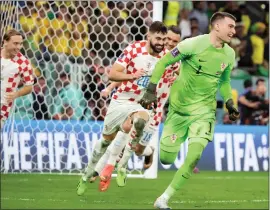  ?? ?? Goalkeeper Dominik Livakovic of Croatia celebrates the victory