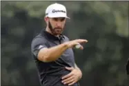  ?? NG HAN GUAN — THE ASSOCIATED PRESS ?? Dustin Johnson of United States gestures in the final round of the 2017 WGC-HSBC Champions golf tournament held at the Sheshan Internatio­nal Golf Club in Shanghai, China, Sunday. Johnson, the world’s No. 1 player going for his third World Golf...