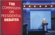  ?? JULIO CORTEZ — THE ASSOCIATED PRESS ?? A member of the production crew stands at a podium near glass barriers to prevent the spread of COVID- 19on stage Wednesday ahead of tonight’s final presidenti­al debate between President Donald Trump and former Vice President Joe Biden.