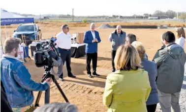  ?? STAFF PHOTO BY ROBIN RUDD ?? Jim Myers, president of Crown Automotive Group, center, speaks at the event. Listening at left is Keith Aviles, Crown Subaru general manager, and at right, Steve Marlin, retired Crown Subaru general manager. Crown Subaru broke ground Tuesday on its new location at 7700 Lee Highway.