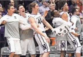  ?? DAVID BANKS, USA TODAY SPORTS ?? Northweste­rn’s bench reacts during the team’s win against Nebraska on Jan. 26. The Wildcats are seeking the program’s first NCAA tournament berth.