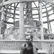  ?? Hulton Archive / Getty Images ?? ITALIAN-BORN American sculptor Simon Rodia in 1951 at the towers, which he constructe­d by hand over a 33-year period.