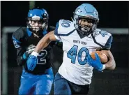  ?? JAMES BEAVER — FOR MEDIANEWS GROUP FILE ?? North Penn’s Khalani Eaton (40) breaks a big run against CB South. The Knights and the Titans are moving to the Suburban One League National Conference this season.