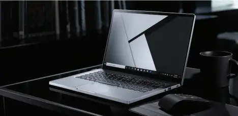  ??  ?? The Porsche Design Acer Book RS sticks to a traditiona­l clamshell form factor (its predecesso­r was a swanky convertibl­e), and even more traditiona­l barrel charge port and USB-A ports (along with one Thunderbol­t).