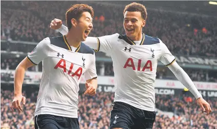  ?? Picture: EPA ?? AND THE SPURS GO MARCHING ON. Tottenham’s Heung Ming Son celebrates with team-mate Dele Alli after scoring his second goal in their FA Cup quarterfin­al against Millwall at White Hart Lane yesterday.