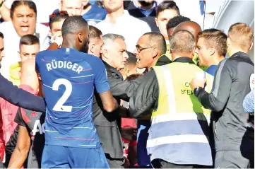  ??  ?? Manchester United manager Jose Mourinho is restrained by stewards after reacting to Chelsea’s second goal at Stamford Bridge, London October 20, 2018. - Reuters photo